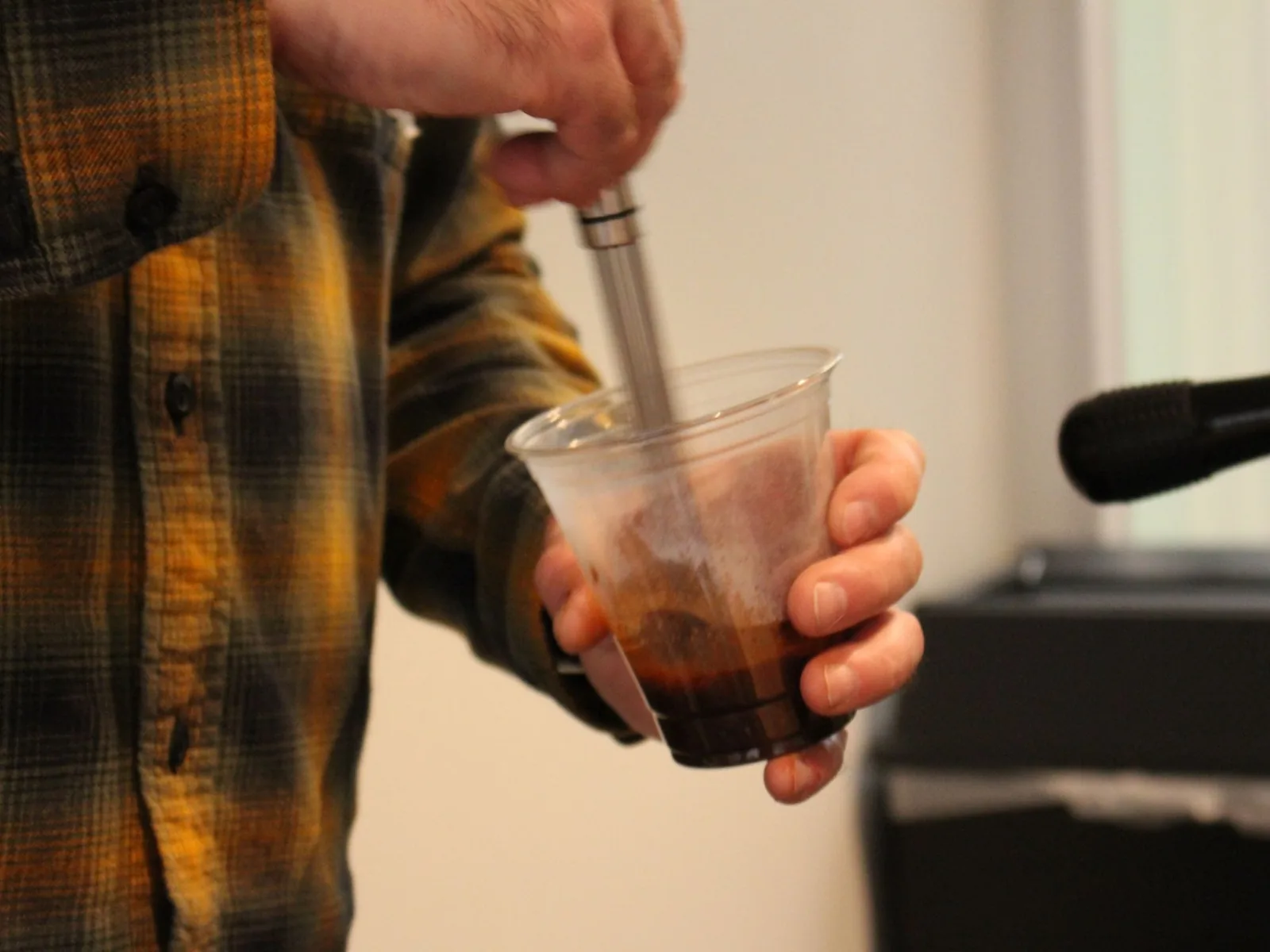 Iced coffee preparation at mobile catering event