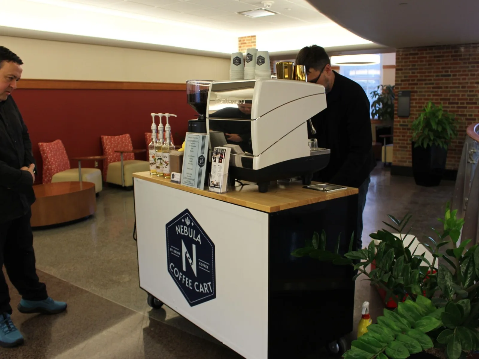 Barista serving guests at corporate reception