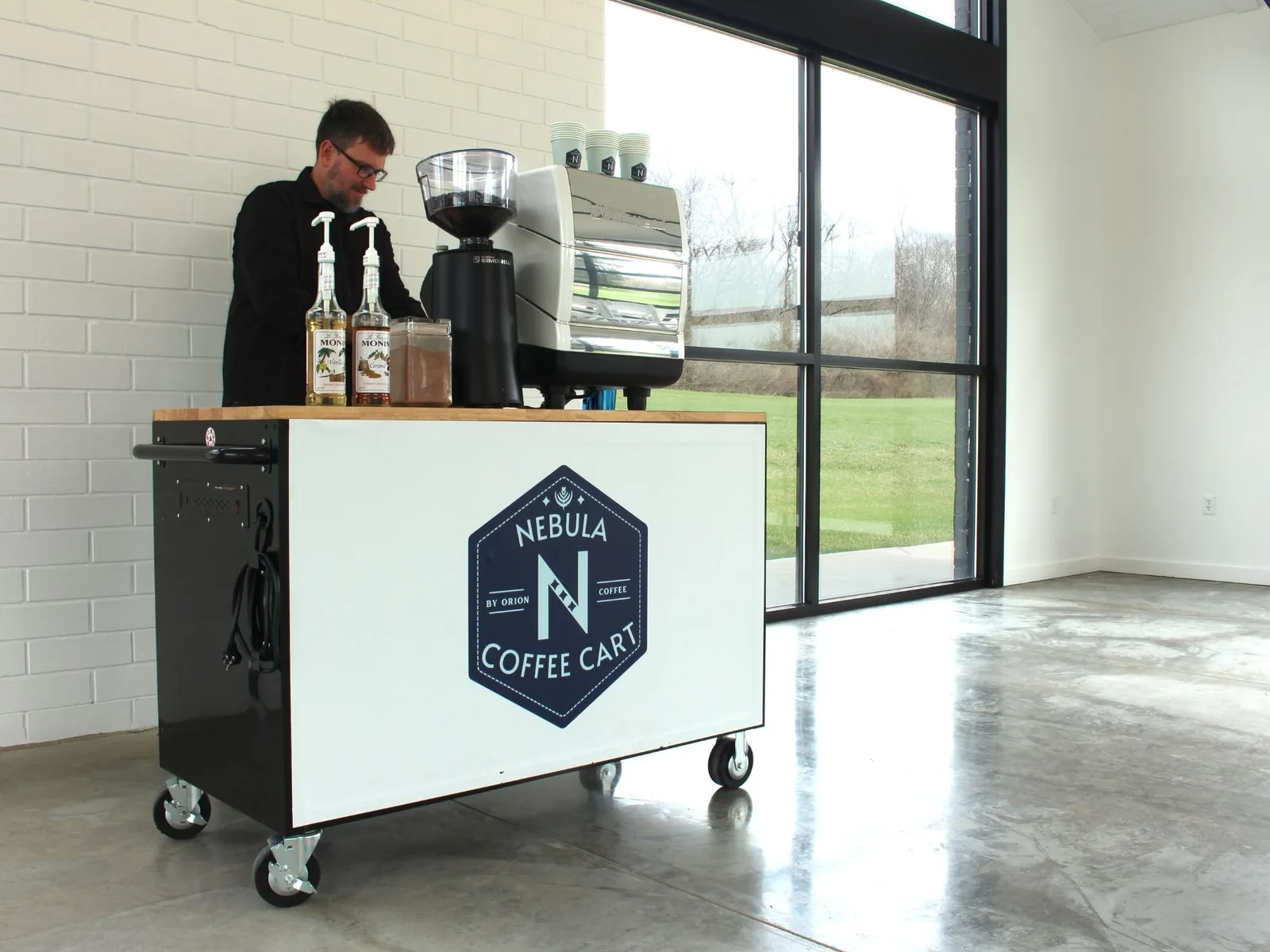 Artisan latte with signature coffee art from mobile coffee catering